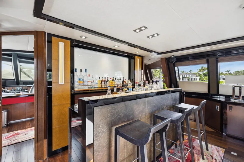 Izumi Yacht Photos Pics Luxurious bar area inside a 2008 Palmer Johnson 120 Sports Cruiser yacht.