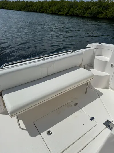  Yacht Photos Pics 2006 Regal Commodore 3560 IO boat interior with white seating by the water.