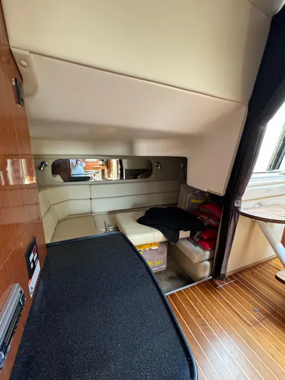  Yacht Photos Pics Interior of 2006 Regal Commodore 3560 IO yacht with cozy seating and wooden flooring.