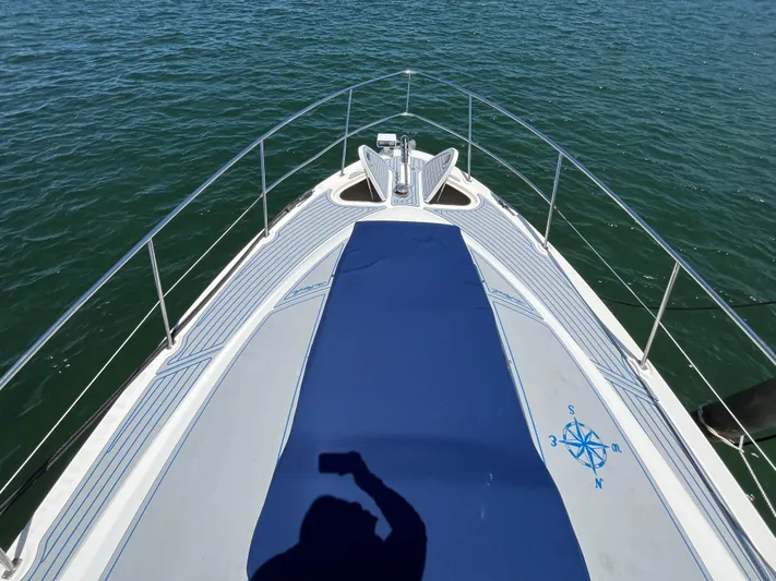 Lazy Days Yacht Photos Pics Bow of 2009 Sea Ray 44 Sedan Bridge yacht on water.