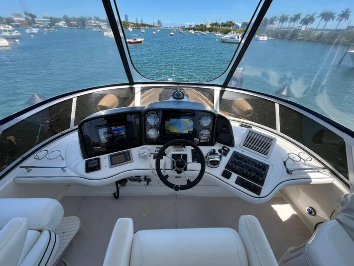Lazy Days Yacht Photos Pics 2009 Sea Ray 44 Sedan Bridge helm with panoramic water view.