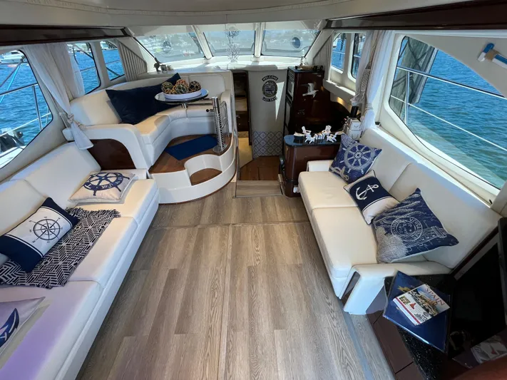 Lazy Days Yacht Photos Pics Luxurious interior of 2009 Sea Ray 44 Sedan Bridge yacht with nautical-themed decor.