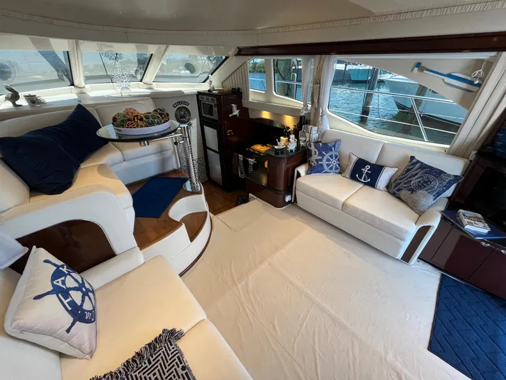 Lazy Days Yacht Photos Pics Luxurious interior of 2009 Sea Ray 44 Sedan Bridge yacht with nautical-themed decor.