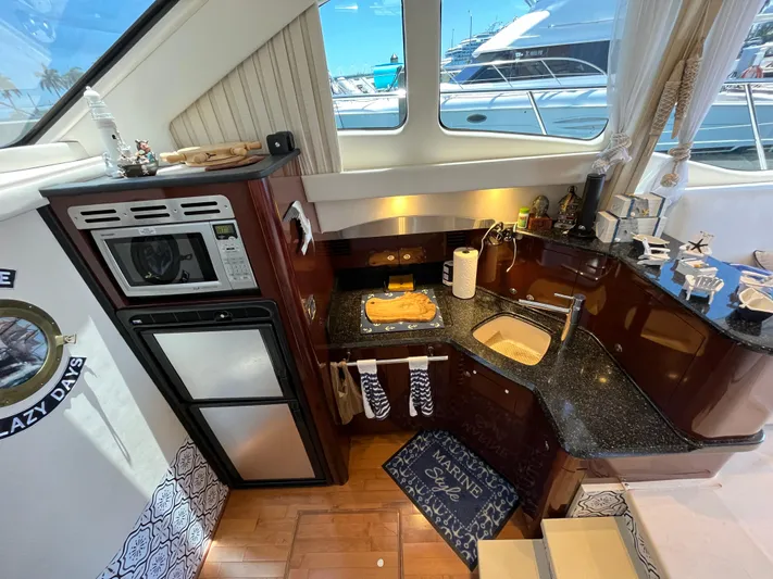 Lazy Days Yacht Photos Pics 2009 Sea Ray 44 Sedan Bridge kitchen with modern appliances and sleek design.