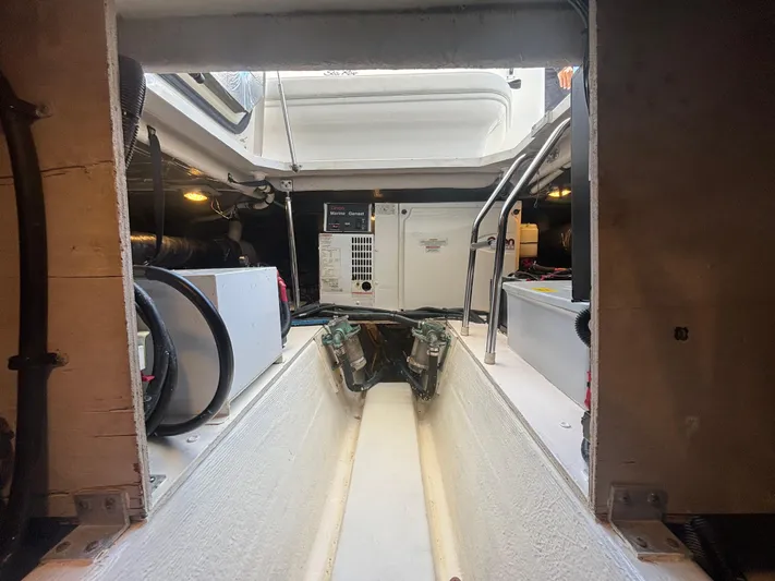 Lazy Days Yacht Photos Pics Engine room of a 2009 Sea Ray 44 Sedan Bridge yacht.