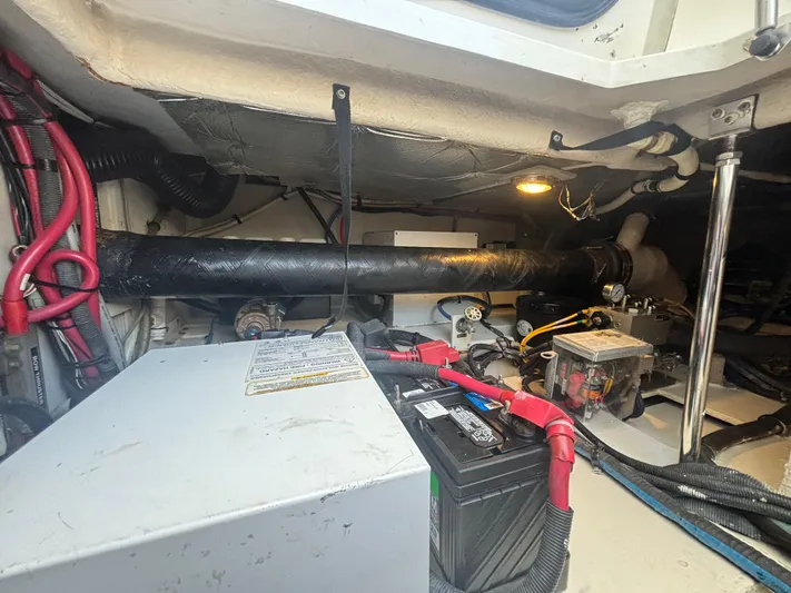 Lazy Days Yacht Photos Pics Engine compartment of a 2009 Sea Ray 44 Sedan Bridge with visible battery and wiring.