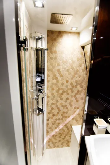 Bugsy Yacht Photos Pics Luxurious bathroom in 2020 Galeon 550 Fly yacht with modern shower and elegant tile design.