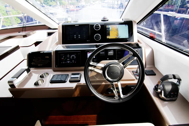 Bugsy Yacht Photos Pics Helm of 2020 Galeon 550 Fly yacht with modern navigation controls and steering wheel.