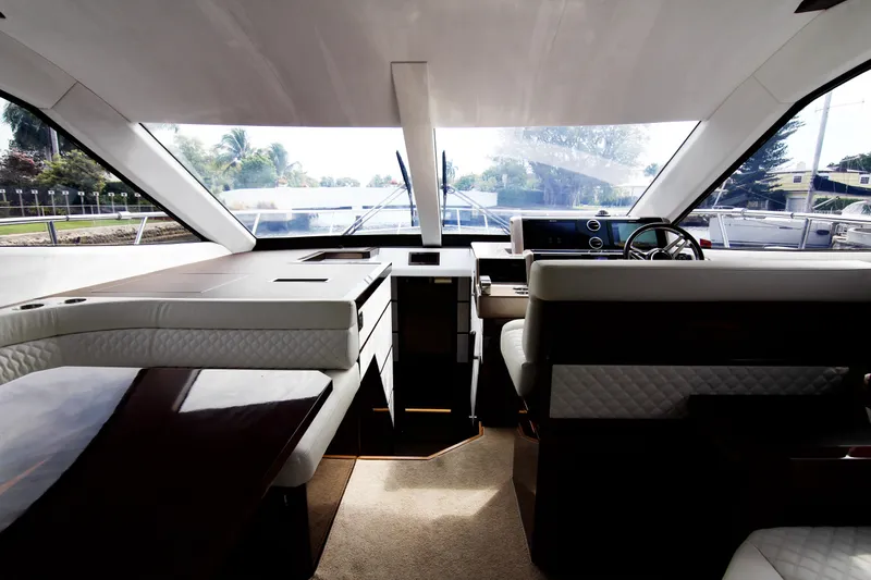 Bugsy Yacht Photos Pics Interior of 2020 Galeon 550 Fly yacht, featuring luxurious seating and modern design.