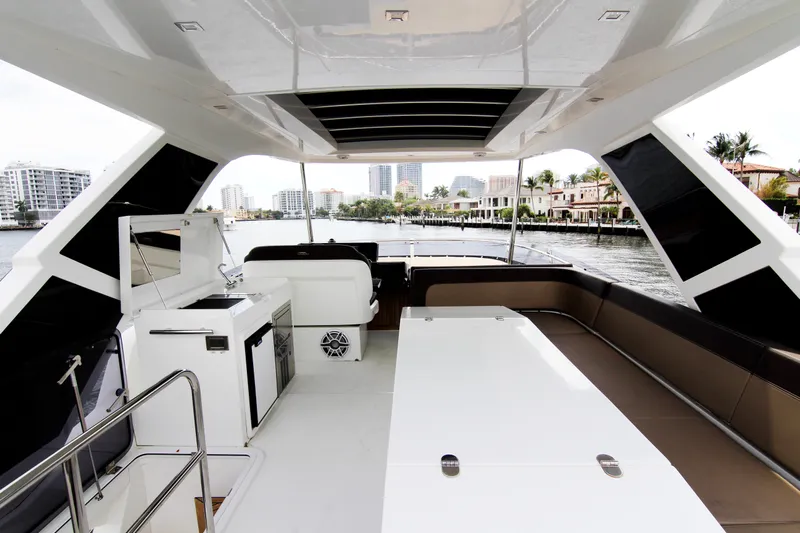 Bugsy Yacht Photos Pics Luxurious 2020 Galeon 550 Fly yacht interior with modern amenities and waterfront view.