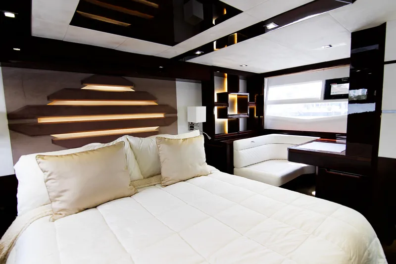 Bugsy Yacht Photos Pics Luxurious interior of 2020 Galeon 550 Fly yacht with modern design and cozy bedding.