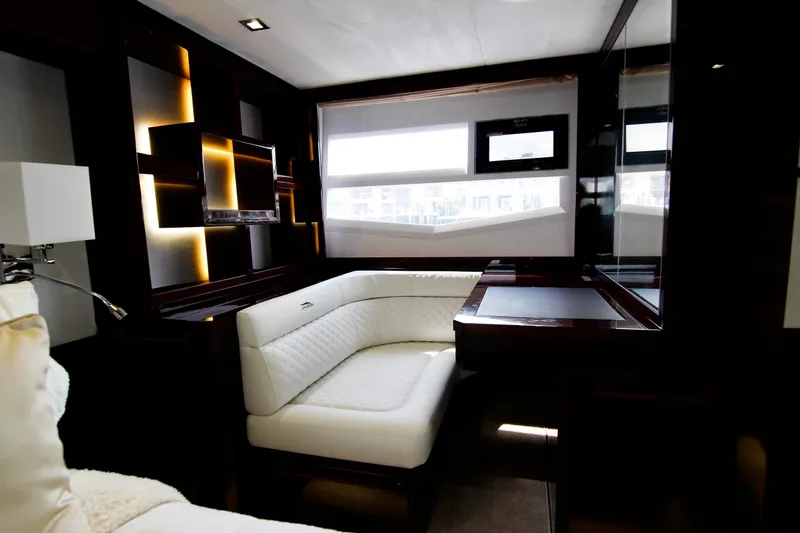 Bugsy Yacht Photos Pics Luxurious interior of 2020 Galeon 550 Fly yacht with modern seating and elegant design.