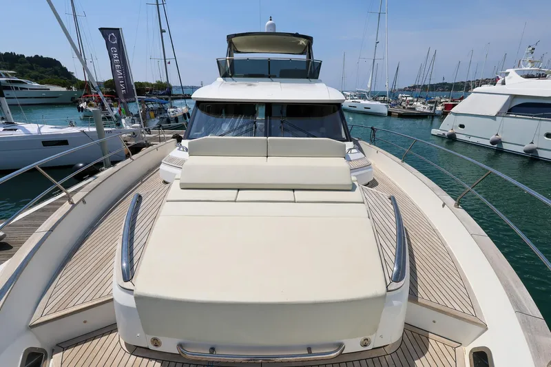 Mas Que Nada Yacht Photos Pics 2021 Greenline OceanClass 68 yacht docked in marina, showcasing sleek design and spacious deck.