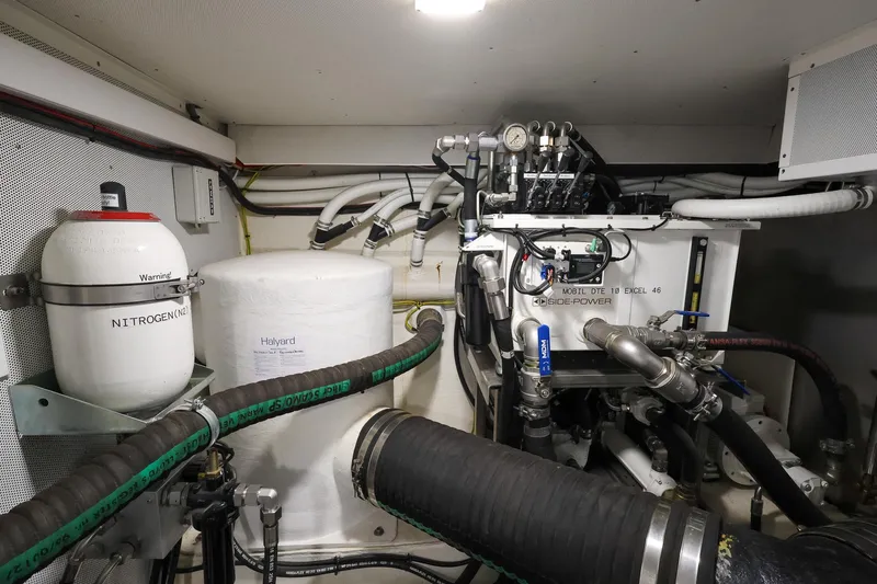 Mas Que Nada Yacht Photos Pics Engine room of 2021 Greenline OceanClass 68 yacht with mechanical components and piping.