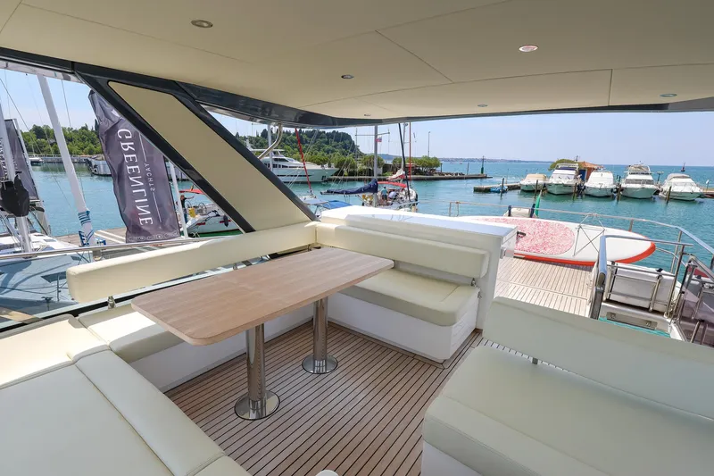 Mas Que Nada Yacht Photos Pics Luxurious Greenline OceanClass 68 yacht interior with elegant seating and scenic marina view, 2021 model.
