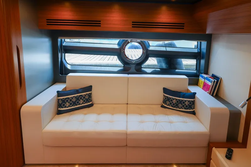 Mas Que Nada Yacht Photos Pics Luxurious interior of 2021 Greenline OceanClass 68 yacht with elegant white sofa and nautical decor.