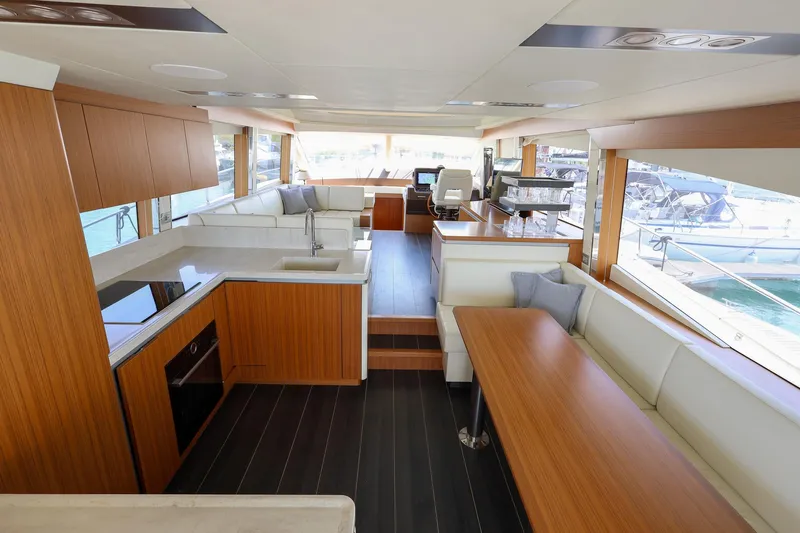 Mas Que Nada Yacht Photos Pics Luxurious interior of 2021 Greenline OceanClass 68 yacht with modern kitchen and seating area.