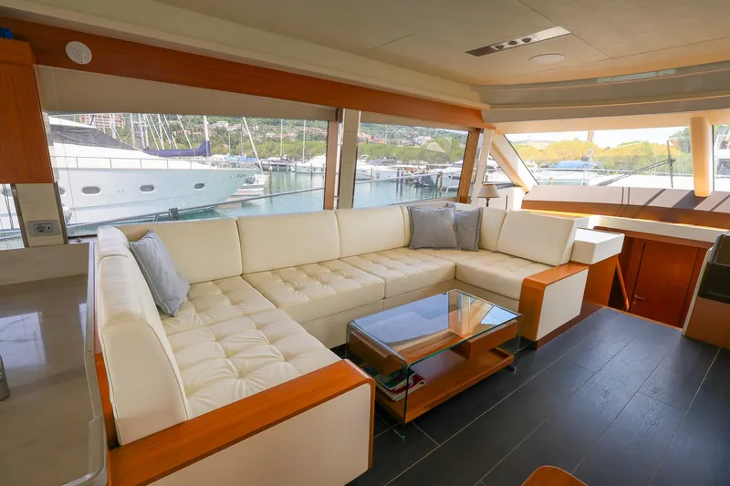 Mas Que Nada Yacht Photos Pics Luxurious interior of 2021 Greenline OceanClass 68 yacht with spacious seating and scenic marina view.