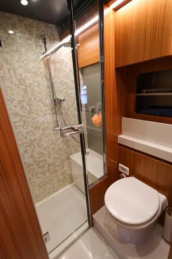 Mas Que Nada Yacht Photos Pics Luxurious bathroom in 2021 Greenline OceanClass 68 yacht with modern shower and wooden accents.