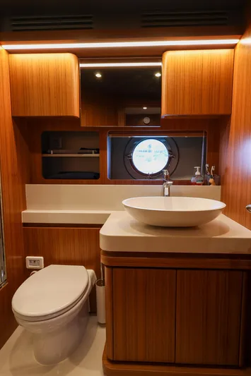 Mas Que Nada Yacht Photos Pics Luxurious bathroom in 2021 Greenline OceanClass 68 yacht with modern fixtures and wood accents.