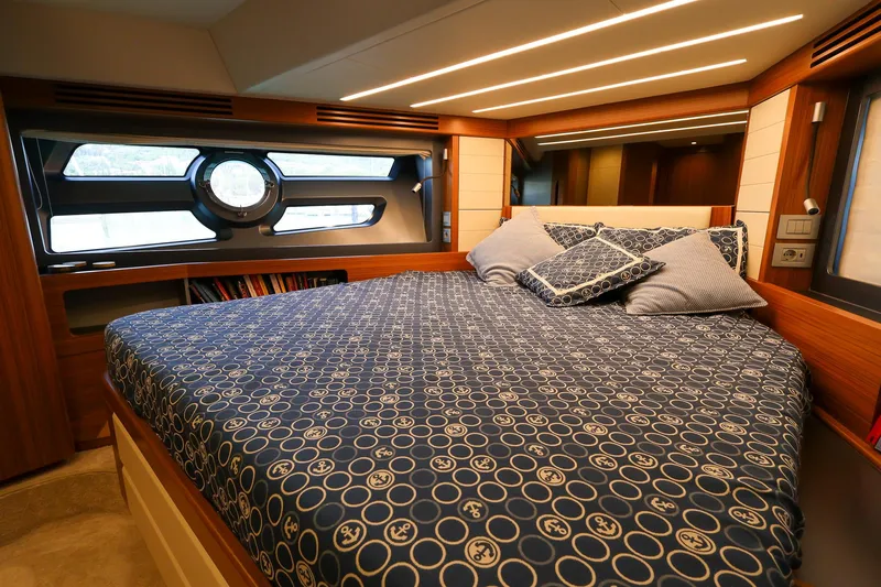 Mas Que Nada Yacht Photos Pics Luxurious bedroom interior of 2021 Greenline OceanClass 68 yacht with modern design and cozy bedding.