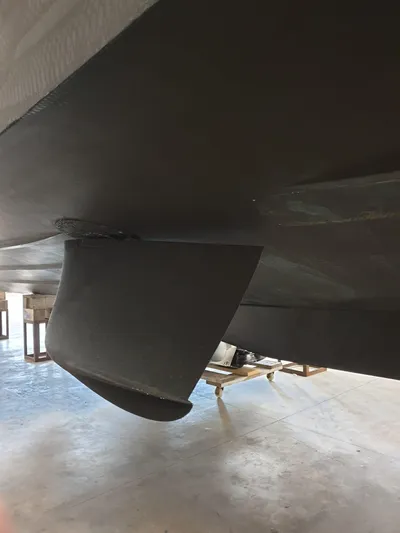 Mas Que Nada Yacht Photos Pics Bottom view of 2021 Greenline OceanClass 68 yacht hull in a workshop.