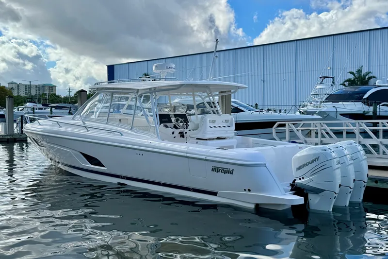  Yacht Photos Pics 2022 Intrepid 409 Valor boat docked with triple Mercury engines.