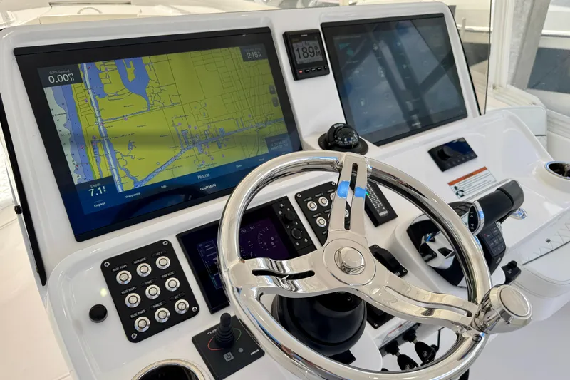 Yacht Photos Pics Helm of 2022 Intrepid 409 Valor featuring advanced navigation displays and controls.