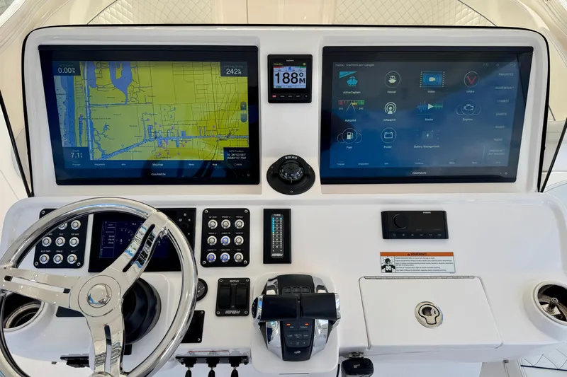  Yacht Photos Pics 2022 Intrepid 409 Valor helm with dual Garmin displays and advanced navigation controls.