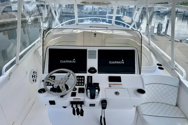  Yacht Photos Pics 2022 Intrepid 409 Valor helm with Garmin displays and luxurious seating.