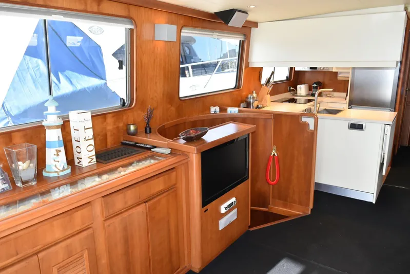 Alieva Yacht Photos Pics Luxurious interior of 2010 Joubert-Nivelt ALIEVA 60 yacht with wooden cabinetry and modern kitchen.