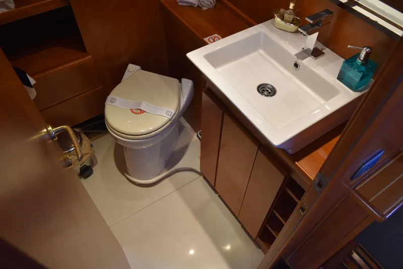Alieva Yacht Photos Pics Compact bathroom in 2010 Joubert-Nivelt ALIEVA 60 yacht with sink and toilet.