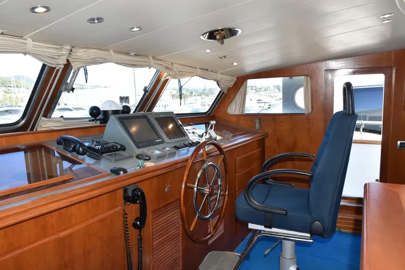 Alieva Yacht Photos Pics Pilothouse of 2010 Joubert-Nivelt ALIEVA 60 yacht with wooden interior and navigation equipment.