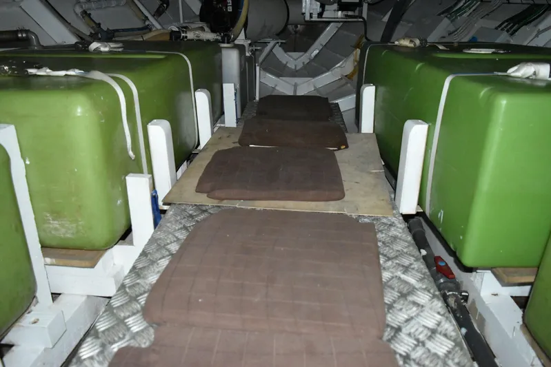 Alieva Yacht Photos Pics Interior of 2010 Joubert-Nivelt ALIEVA 60 with green storage tanks and padded flooring.