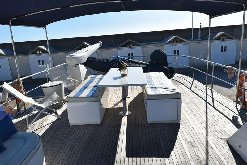 Alieva Yacht Photos Pics Spacious deck of 2010 Joubert-Nivelt ALIEVA 60 yacht with seating and table.