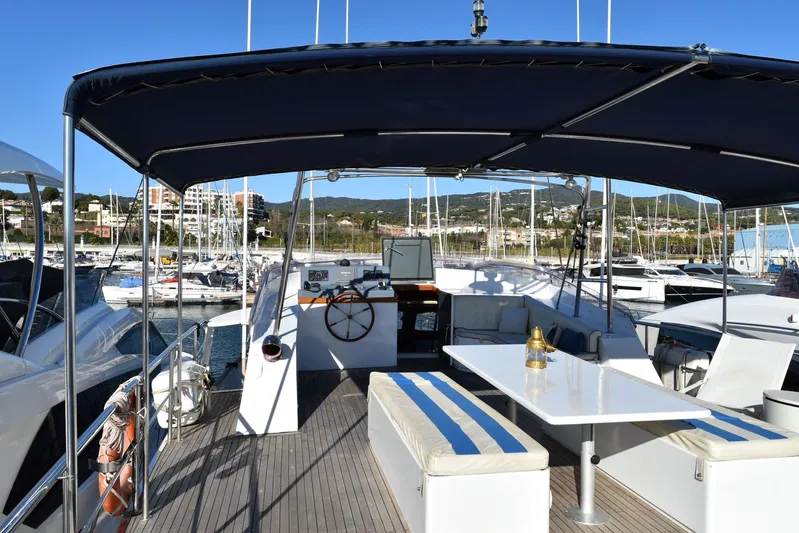 Alieva Yacht Photos Pics Spacious deck of 2010 Joubert-Nivelt ALIEVA 60 yacht in marina setting.