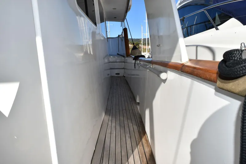 Alieva Yacht Photos Pics Side deck of 2010 Joubert-Nivelt ALIEVA 60 yacht with wooden railings.