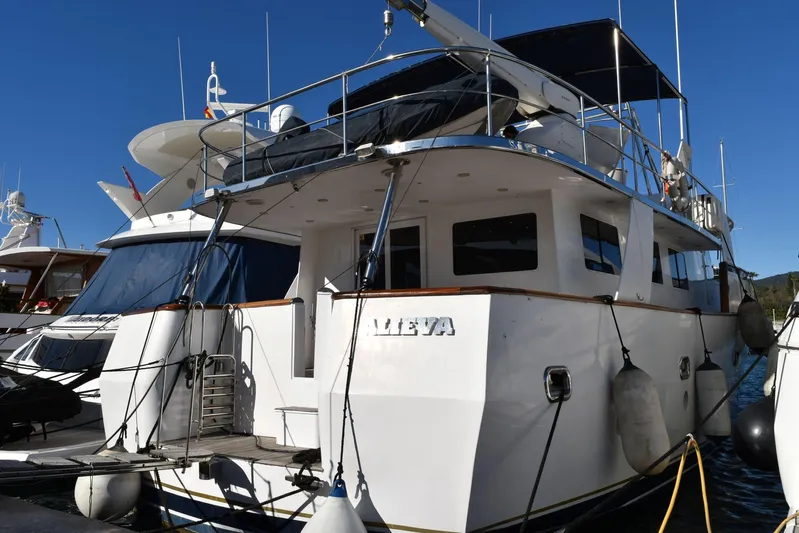 Alieva Yacht Photos Pics Luxury yacht Joubert-Nivelt ALIEVA 60, 2010 model, docked in a marina under clear blue skies.