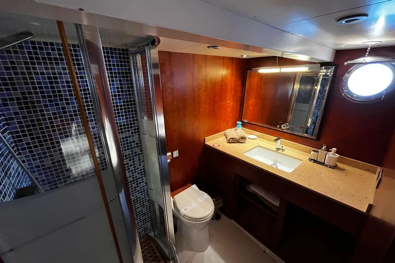 Alieva Yacht Photos Pics Luxurious bathroom in 2010 Joubert-Nivelt ALIEVA 60 yacht with modern fixtures and wood accents.