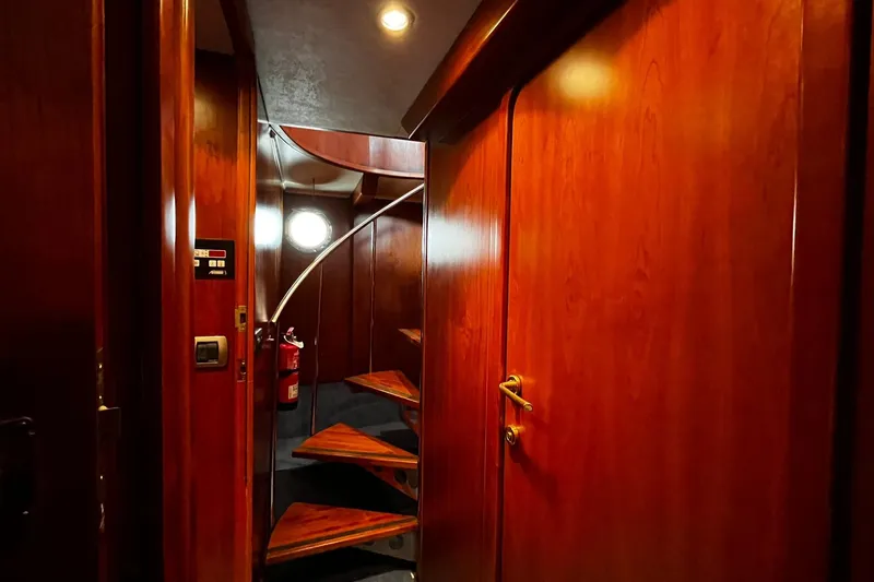 Alieva Yacht Photos Pics Luxurious wooden interior of 2010 Joubert-Nivelt ALIEVA 60 yacht with spiral staircase.