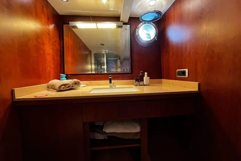 Alieva Yacht Photos Pics Luxurious bathroom in 2010 Joubert-Nivelt ALIEVA 60 yacht with wooden finish and modern fixtures.