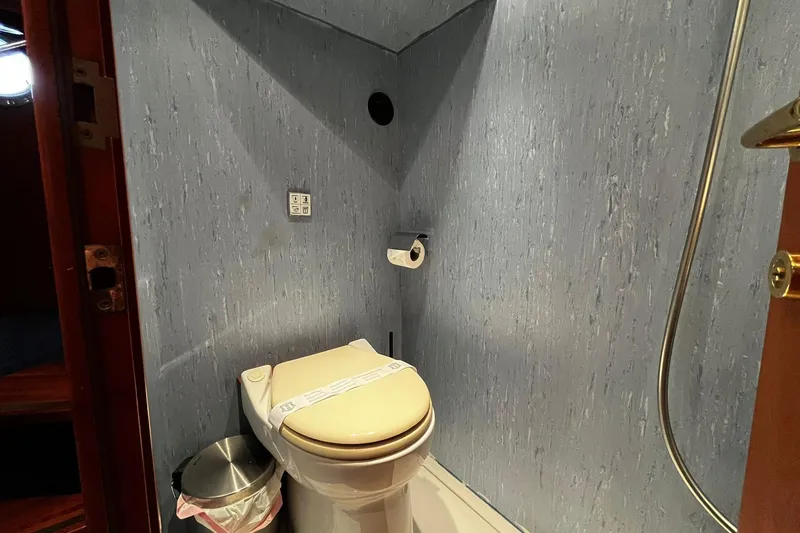 Alieva Yacht Photos Pics Compact bathroom in 2010 Joubert-Nivelt ALIEVA 60 yacht with toilet and waste bin.