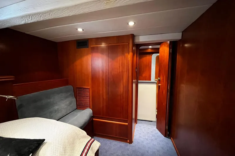 Alieva Yacht Photos Pics Luxurious interior of 2010 Joubert-Nivelt ALIEVA 60 yacht with wood paneling and cozy seating.