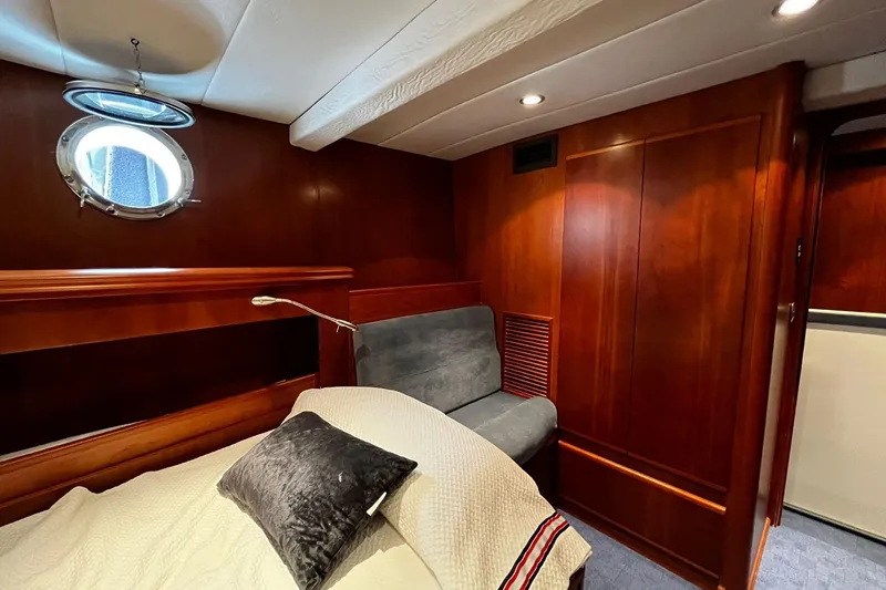 Alieva Yacht Photos Pics Luxurious cabin interior of 2010 Joubert-Nivelt ALIEVA 60 yacht with wood paneling.
