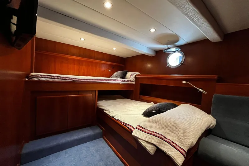 Alieva Yacht Photos Pics Cozy cabin interior of 2010 Joubert-Nivelt ALIEVA 60 yacht with wooden bunk beds.