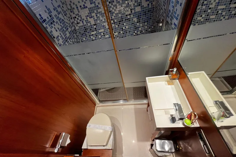 Alieva Yacht Photos Pics Luxurious bathroom in 2010 Joubert-Nivelt ALIEVA 60 yacht with modern fixtures and wood accents.