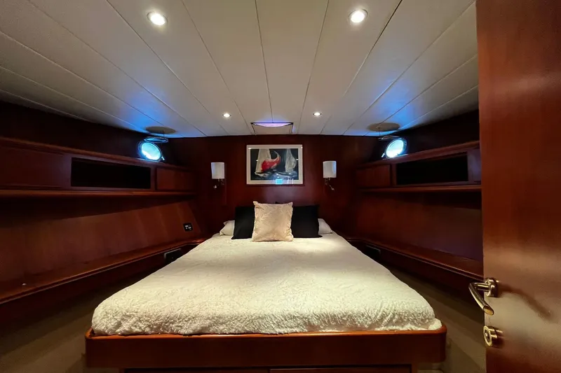 Alieva Yacht Photos Pics Luxurious cabin interior of 2010 Joubert-Nivelt ALIEVA 60 yacht with cozy bed and elegant wood finish.