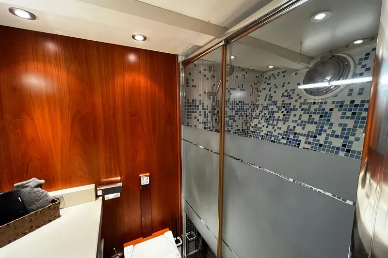 Alieva Yacht Photos Pics Luxurious bathroom in 2010 Joubert-Nivelt ALIEVA 60 yacht with wood paneling and mosaic tiles.