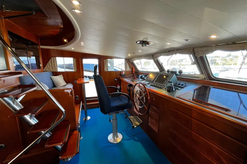 Alieva Yacht Photos Pics Luxurious 2010 Joubert-Nivelt ALIEVA 60 yacht interior with wooden helm and modern navigation equipment.