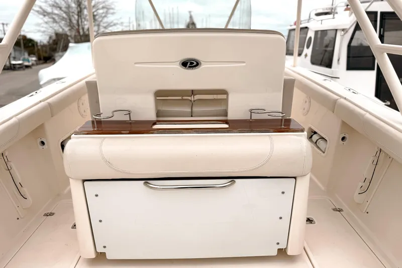  Yacht Photos Pics 2014 Pursuit S 280 Sport boat interior with seating and storage compartments.